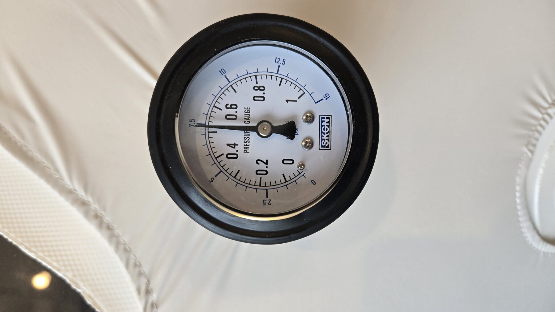 Close-up of the chamber's pressure gauge.